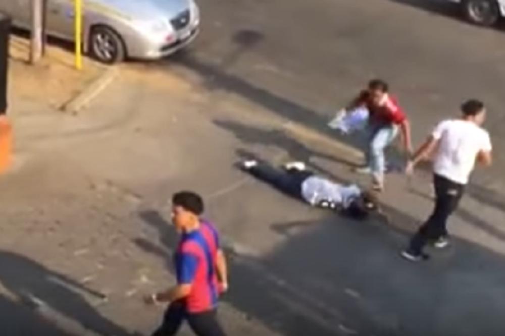 ŽIVOTINJE! Ugazili mu glavu dok je ležao! Navijači Barselone nemilosrdno tukli pristalicu Reala! (UZNEMIRUJUĆI VIDEO)