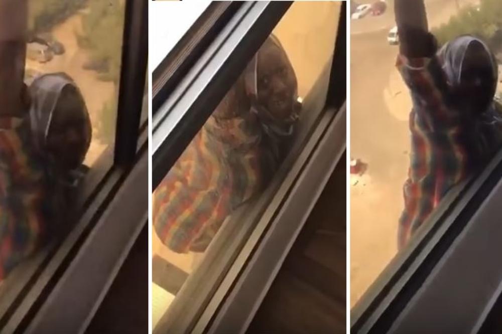 ŽENA ZLO: Okrutna bogatašica snimala i nije htela da pomogne sluškinji koja visi sa prozora zgrade! (VIDEO)