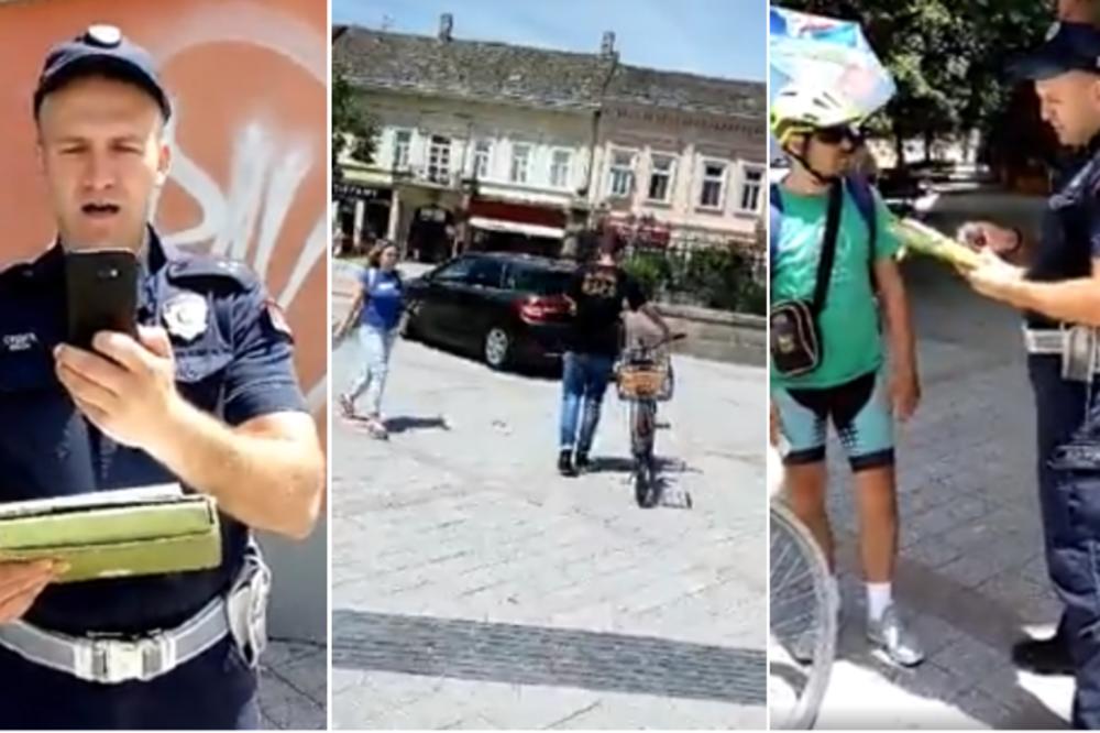 BAHATI POLICAJAC USRED NOVOG SADA PIŠE KAZNU BICIKLISTI, dok se popovi automobilima voze pešačkom zonom! (VIDEO)